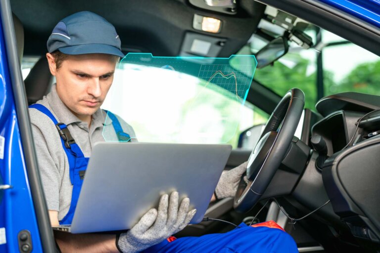 The car's electronic programming uses the laptop to link and checks the data in the engine by monitoring the digitization display to keep and tune the best performance of the engine in the garage or car repair shop. Tuning up for the best performance