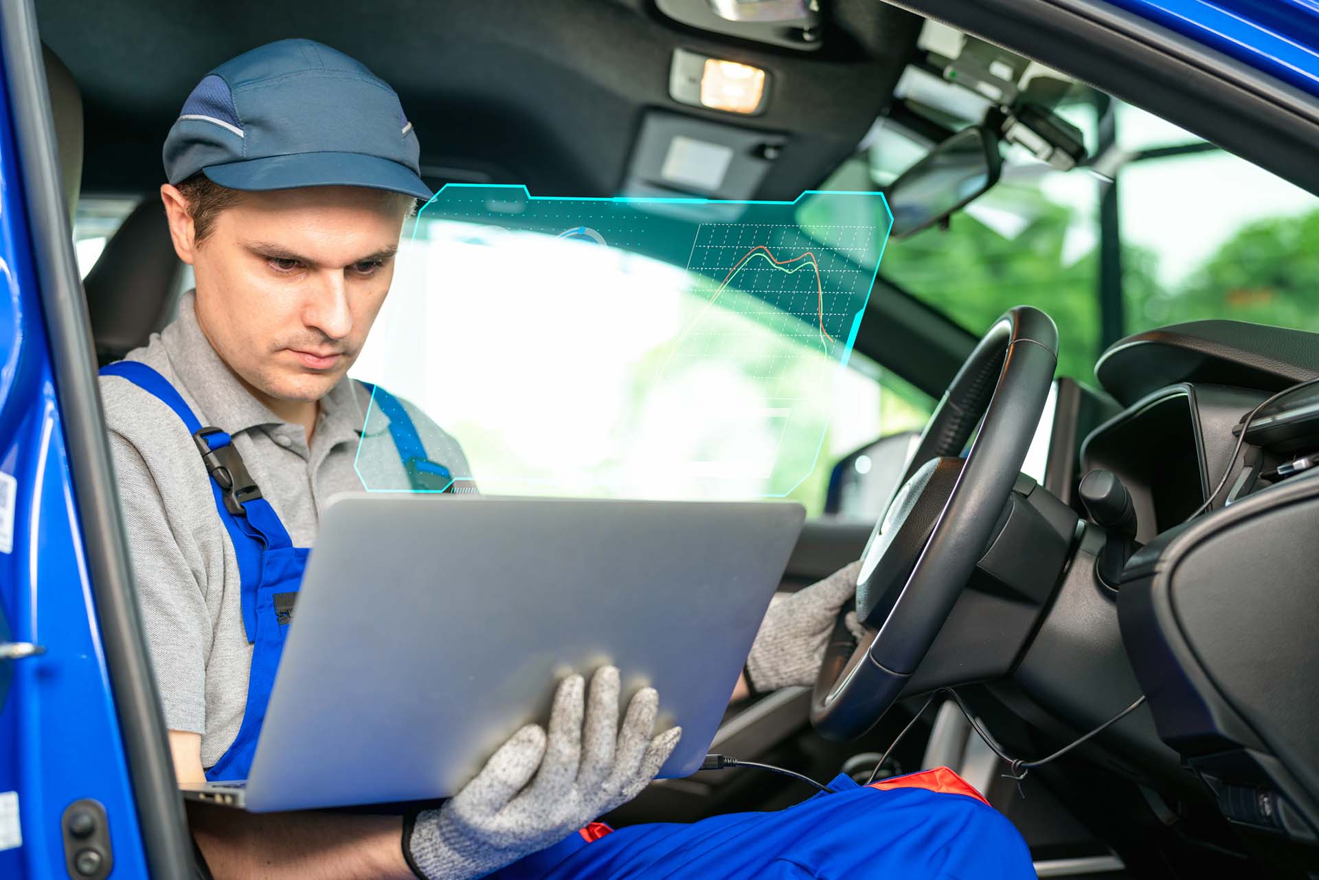 The car's electronic programming uses the laptop to link and checks the data in the engine by monitoring the digitization display to keep and tune the best performance of the engine in the garage or car repair shop. Tuning up for the best performance.