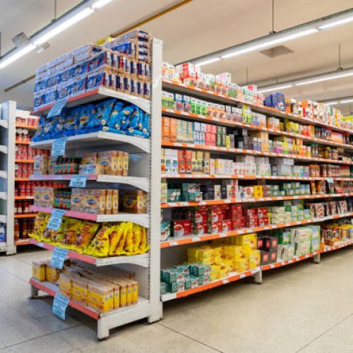 Variety of products on the different aisles and shelfs at the supermarket - No people